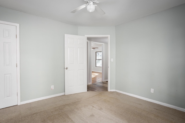 unfurnished bedroom with carpet flooring, ceiling fan, and baseboards