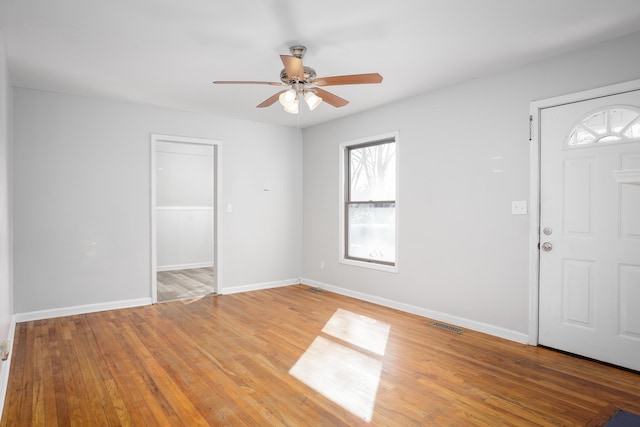 entrance foyer featuring light wood-style flooring, visible vents, and baseboards