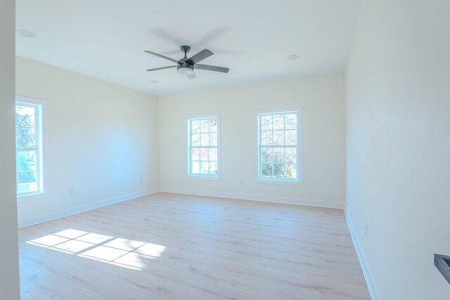  - empty room with light wood-style flooring and ceiling fan