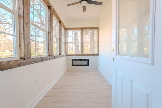 - unfurnished sunroom with wood finished floors and healthy amount of natural light