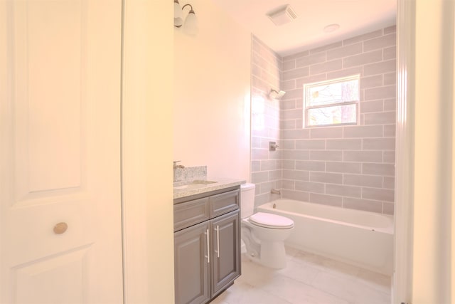  - bathroom featuring vanity, tub / shower combination, and tile patterned flooring