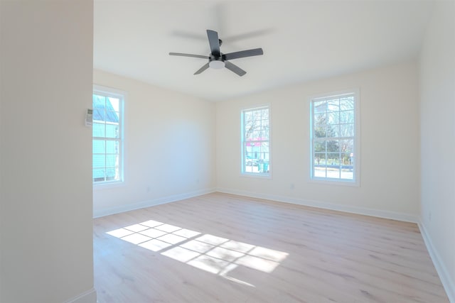  - empty room with light wood-style floors and ceiling fan