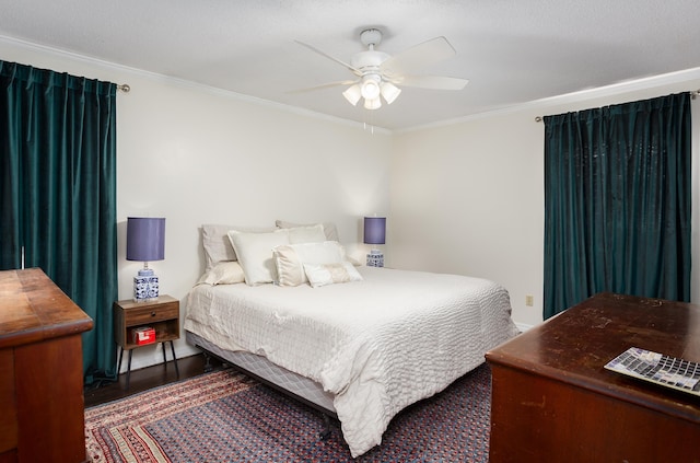 bedroom featuring ornamental molding, ceiling fan, and wood finished floors