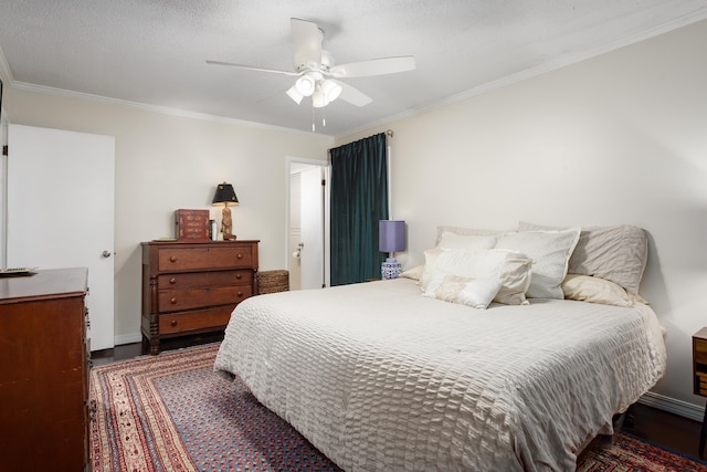 bedroom with baseboards, ornamental molding, a ceiling fan, a textured ceiling, and wood finished floors