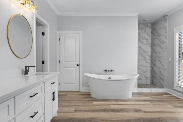 full bathroom with wood finished floors, vanity, and ornamental molding