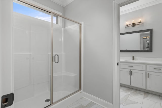 full bathroom featuring marble finish floor, a stall shower, vanity, and crown molding