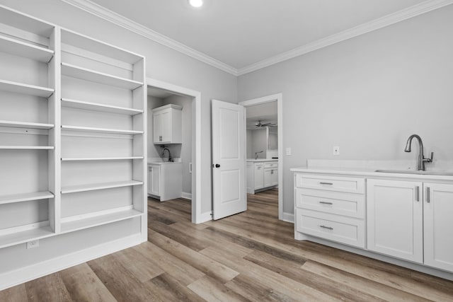 interior space with a sink and wood finished floors