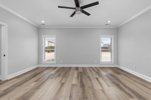 spare room featuring a wealth of natural light and baseboards