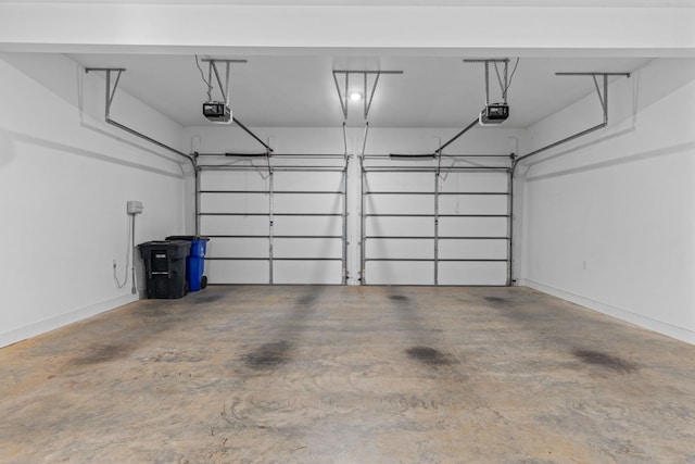 garage featuring baseboards and a garage door opener