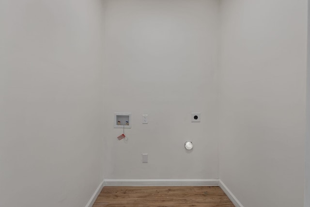  - washroom featuring hookup for a washing machine, electric dryer hookup, baseboards, and light wood-style floors