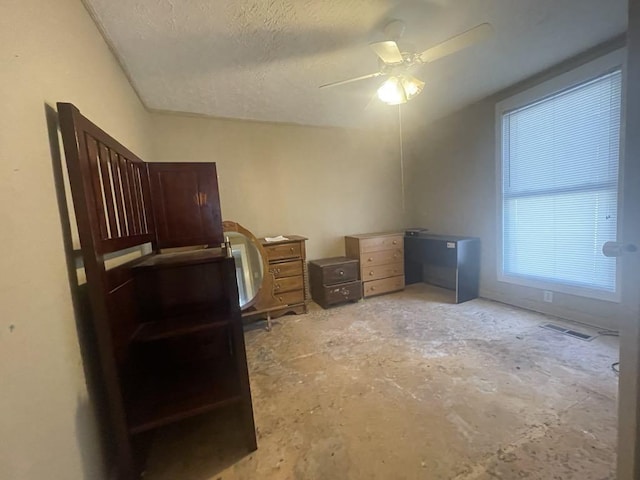 office featuring ceiling fan and a textured ceiling