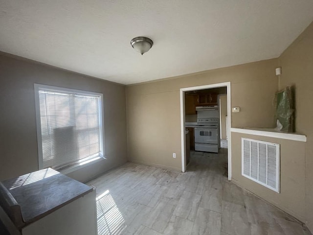 unfurnished dining area featuring light hardwood / wood-style flooring