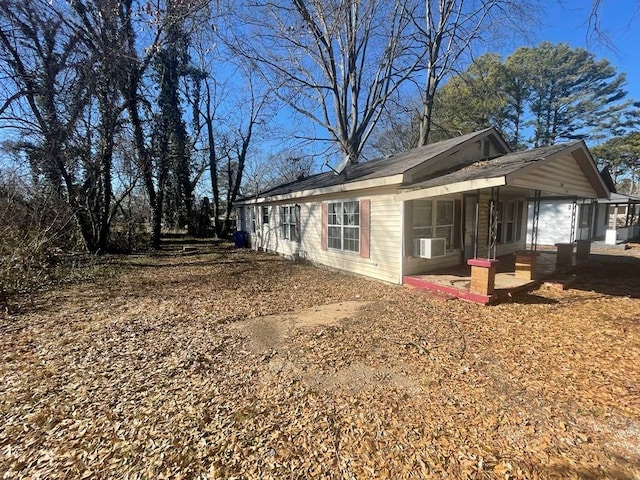 view of side of home featuring cooling unit