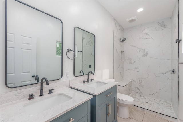  - full bathroom featuring a marble finish shower, toilet, two vanities, and recessed lighting