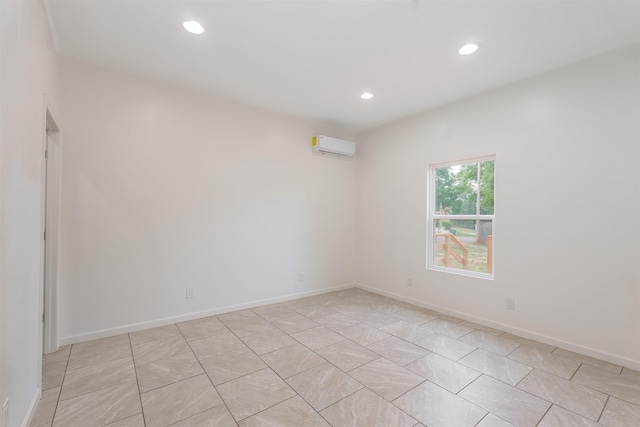 - unfurnished room with recessed lighting, a wall mounted AC, light tile patterned floors, and baseboards