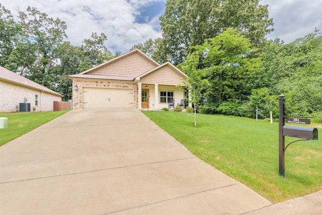181 Silver Leaf Ln, Florence, AL - view of front of house featuring a front yard, driveway, a garage, and brick siding