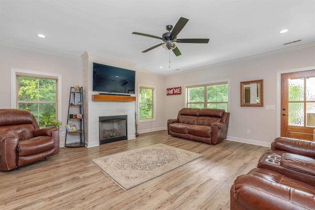 181 Silver Leaf Ln, Florence, AL - living area featuring a fireplace, ceiling fan, crown molding, wood finished floors, and recessed lighting