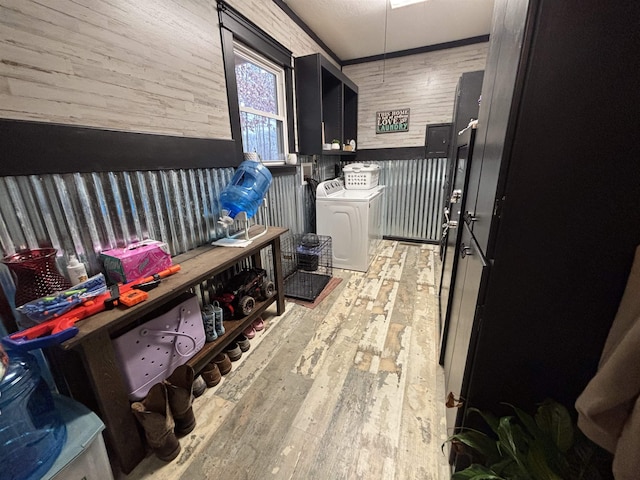 corridor with light hardwood / wood-style floors and washer and clothes dryer