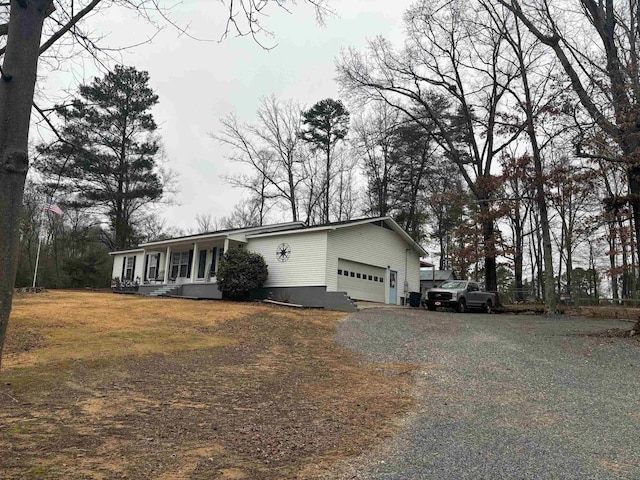 view of front facade featuring a garage and covered porch