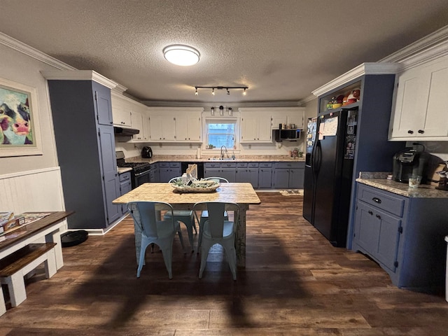 kitchen with a textured ceiling, crown molding, white cabinets, and black appliances