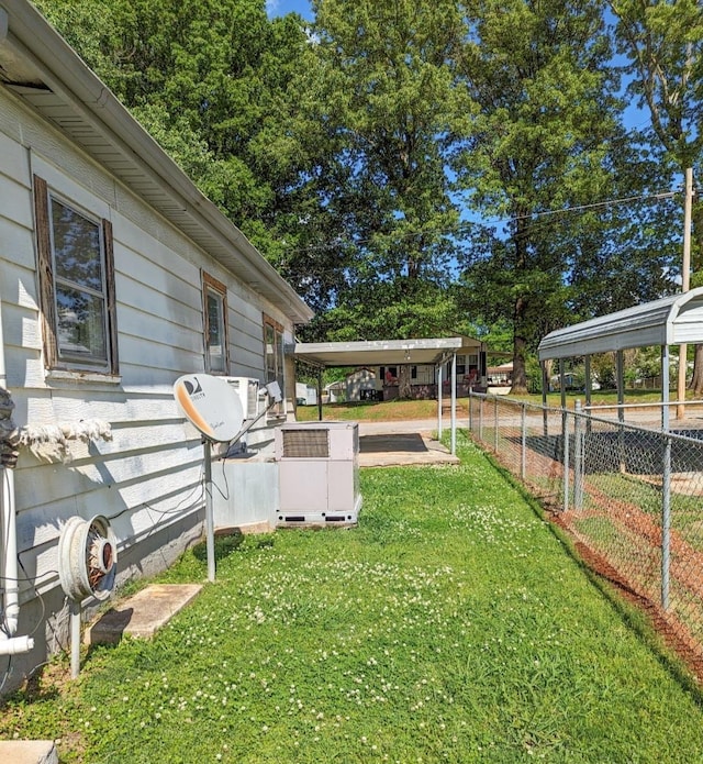  - view of yard featuring a carport