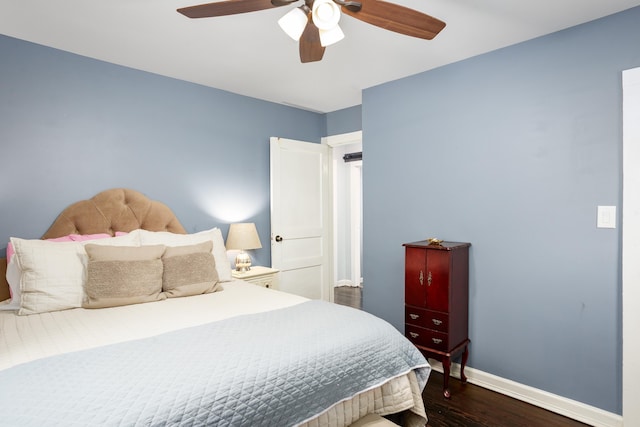  - bedroom featuring dark wood-type flooring, baseboards, and a ceiling fan