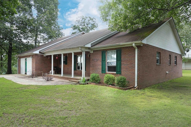  - view of front facade featuring a porch, a garage, brick siding, a front lawn, and roof with shingles