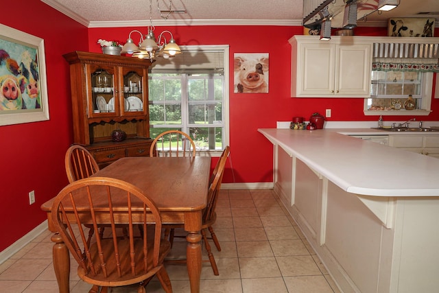  - dining area featuring light tile patterned flooring, a chandelier, baseboards, ornamental molding, and a textured ceiling
