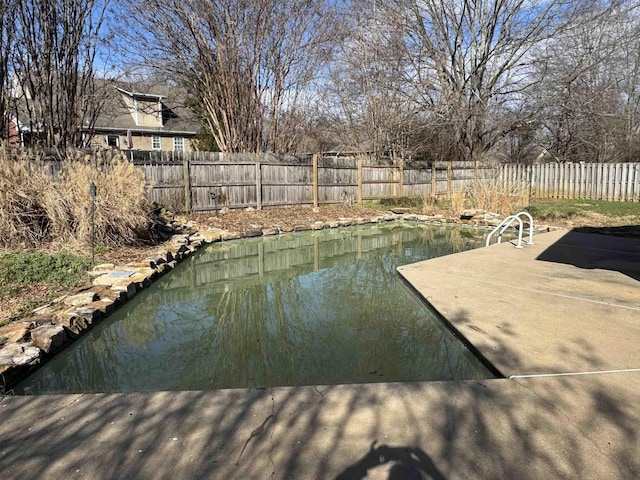 view of swimming pool featuring a patio area and a fenced backyard