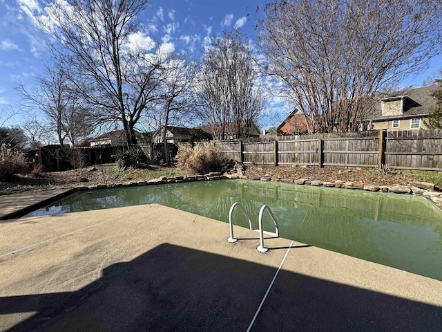 dock area with a patio area and a fenced backyard