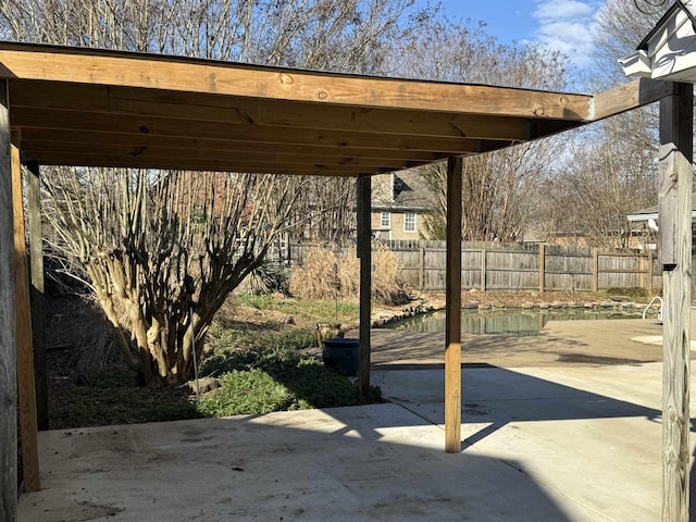 view of patio / terrace featuring fence