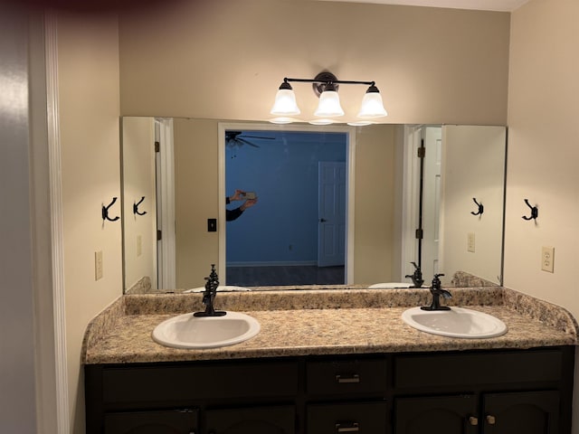 full bath featuring double vanity and a sink