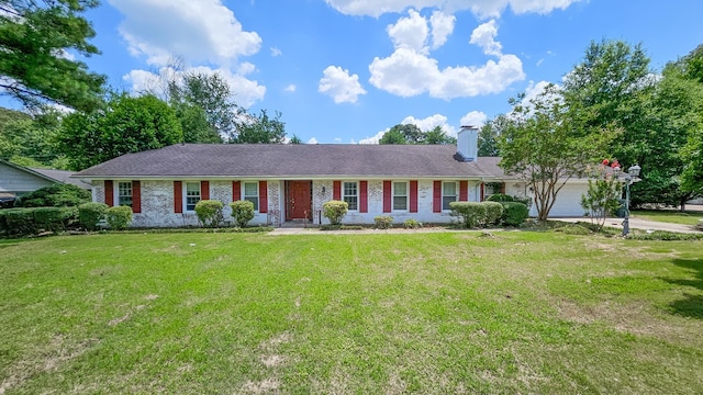  - ranch-style house featuring an attached garage, a chimney, a front lawn, and brick siding