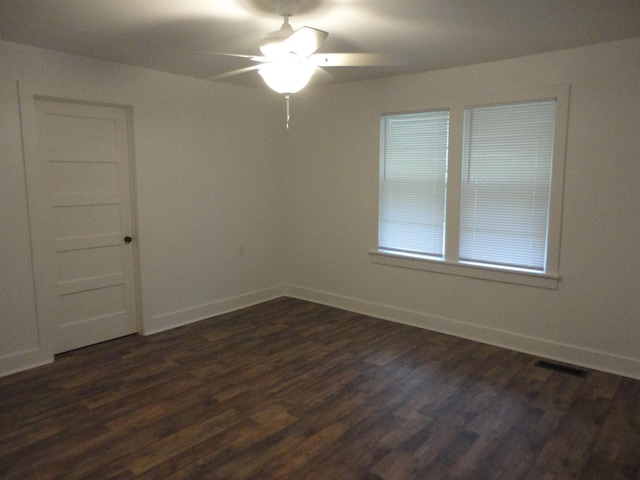 unfurnished room featuring dark hardwood / wood-style floors and ceiling fan