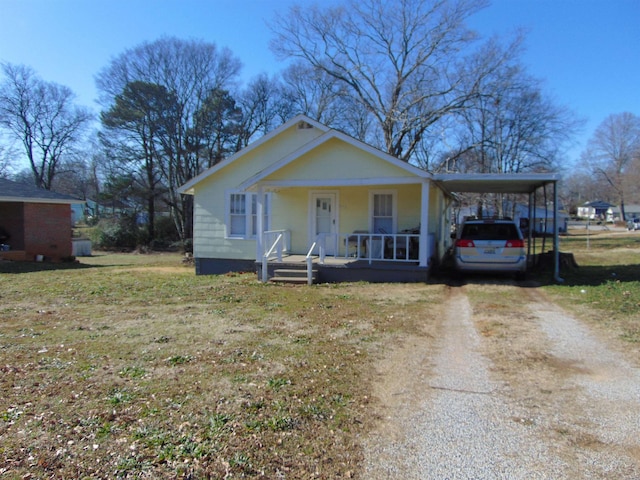 view of front of home featuring covered porch and a carport