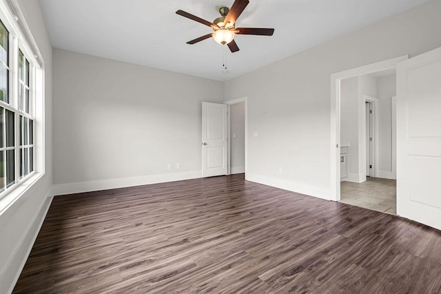 spare room with hardwood / wood-style floors and ceiling fan