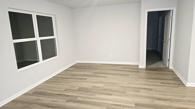 spare room with light hardwood / wood-style flooring