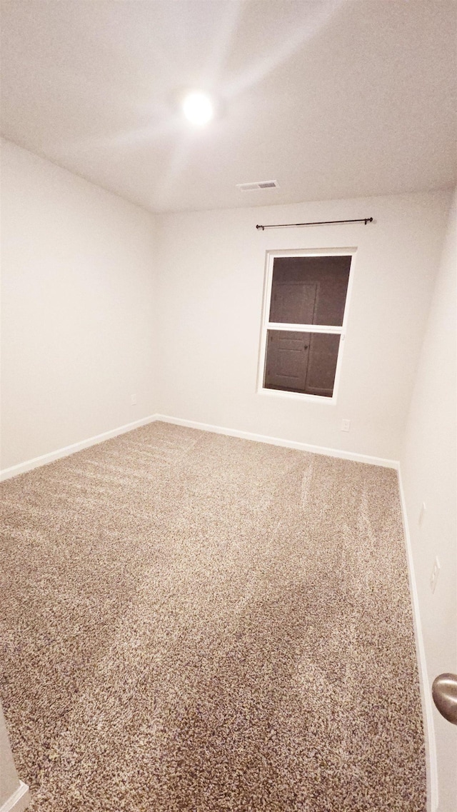 unfurnished room with carpet floors