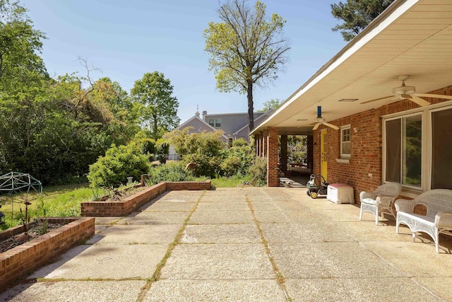  - view of patio / terrace featuring a ceiling fan