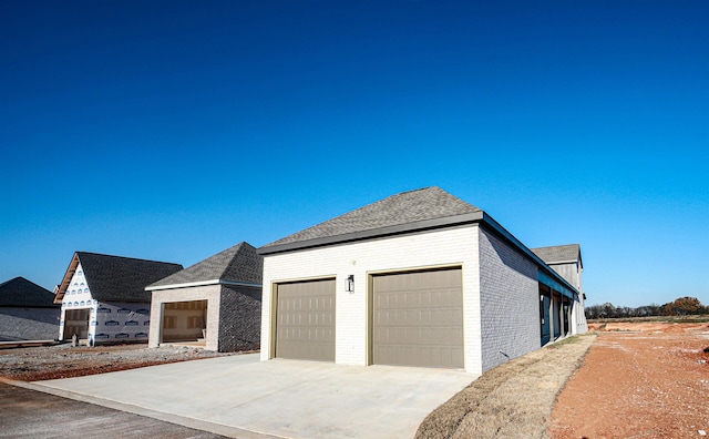 view of side of property with a garage