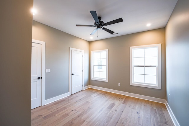 unfurnished bedroom featuring ceiling fan and light hardwood / wood-style floors