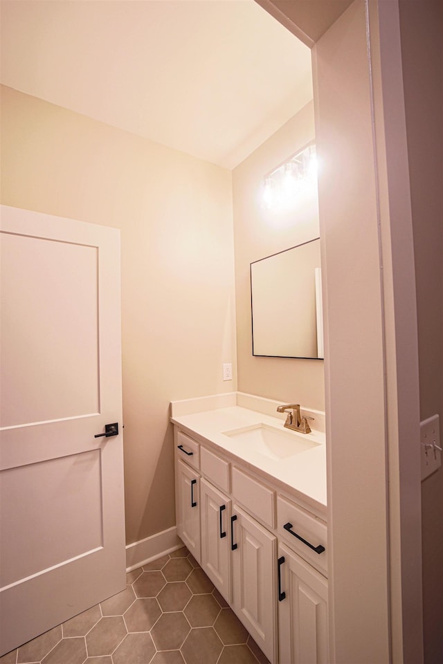 bathroom with tile patterned flooring and vanity