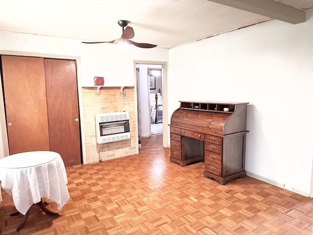  - kitchen featuring heating unit, ceiling fan, and a fireplace