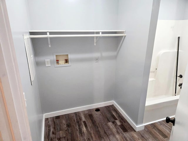 washroom with dark wood-style floors, washer hookup, baseboards, and hookup for an electric dryer