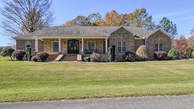 view of front facade featuring a porch and a front yard