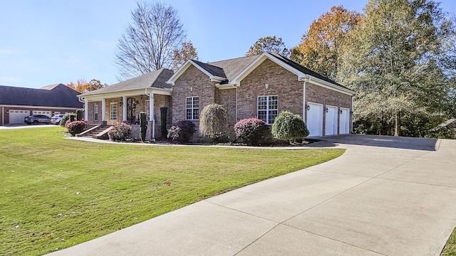 view of front of home with a front lawn and a garage