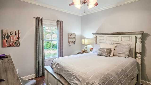 bedroom with dark wood-type flooring, ceiling fan, and ornamental molding