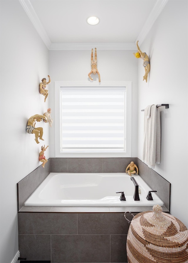 full bath featuring a bath and ornamental molding