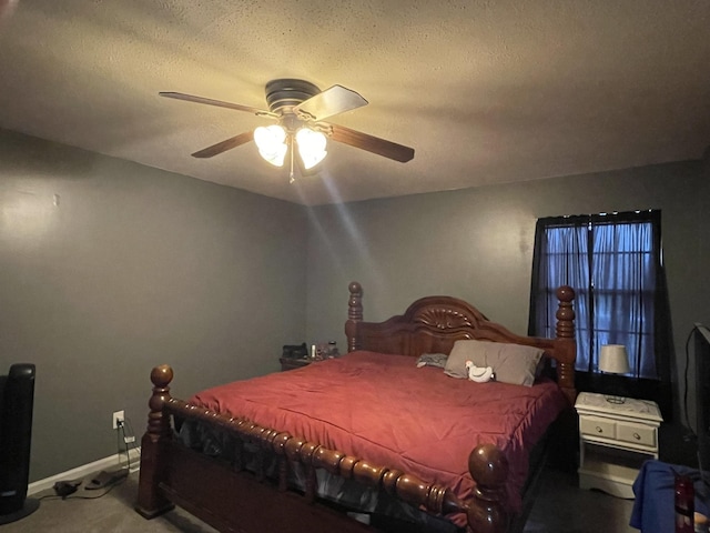 bedroom with a textured ceiling and ceiling fan