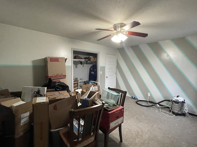 office with ceiling fan and a textured ceiling